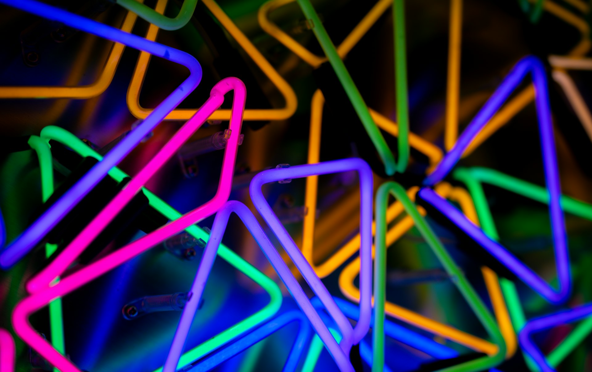 Colorful glow sticks arranged in abstract shapes