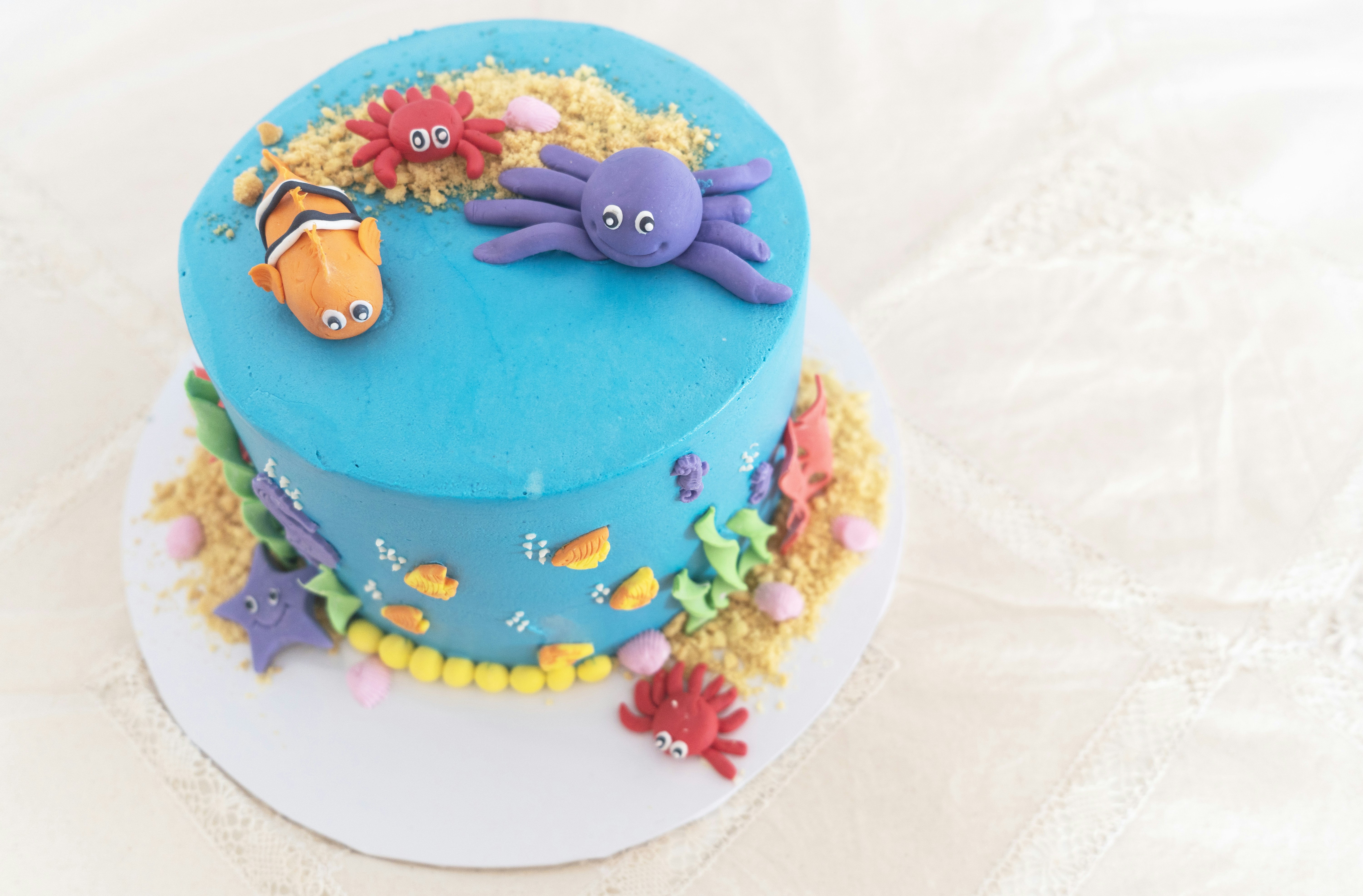 Ocean themed cake with sea creatures and decorations