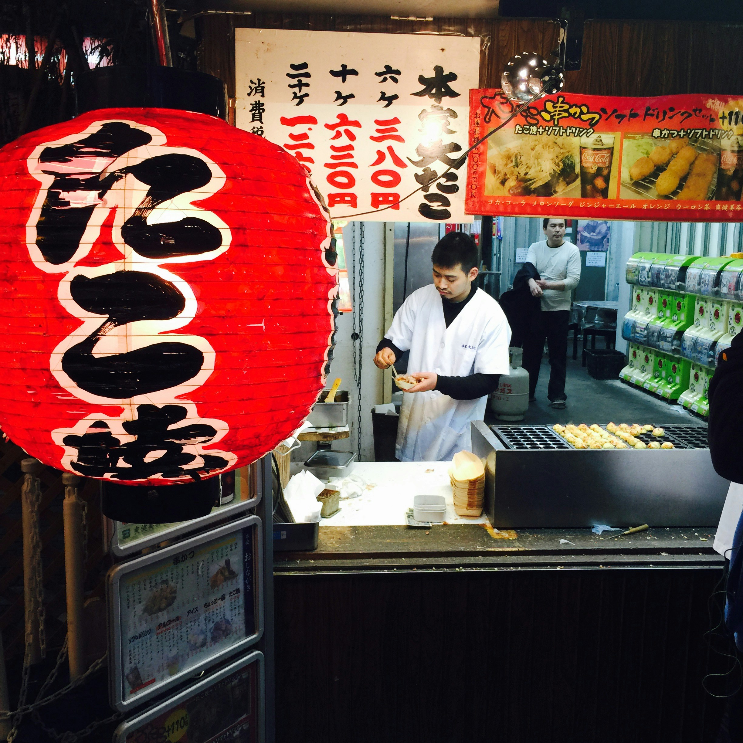Man cooking food at a japanese street food stall.