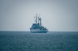 A large ship sails on the open ocean.