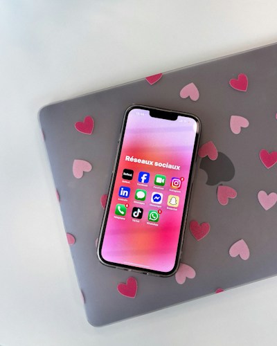 Instagram app open on a phone next to social media icons, representing Instagram Stories for marketing