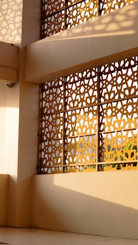 Geometric screen casting shadows on a wall