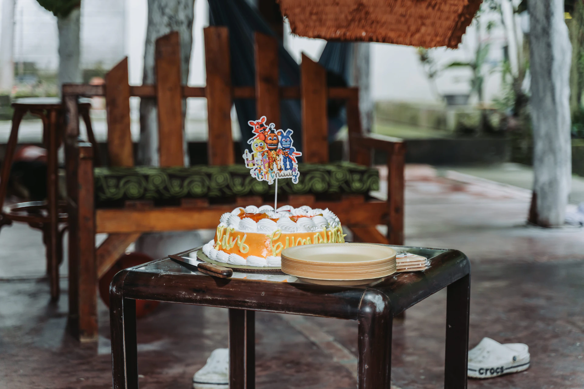 A decorated cake sits on a small table.