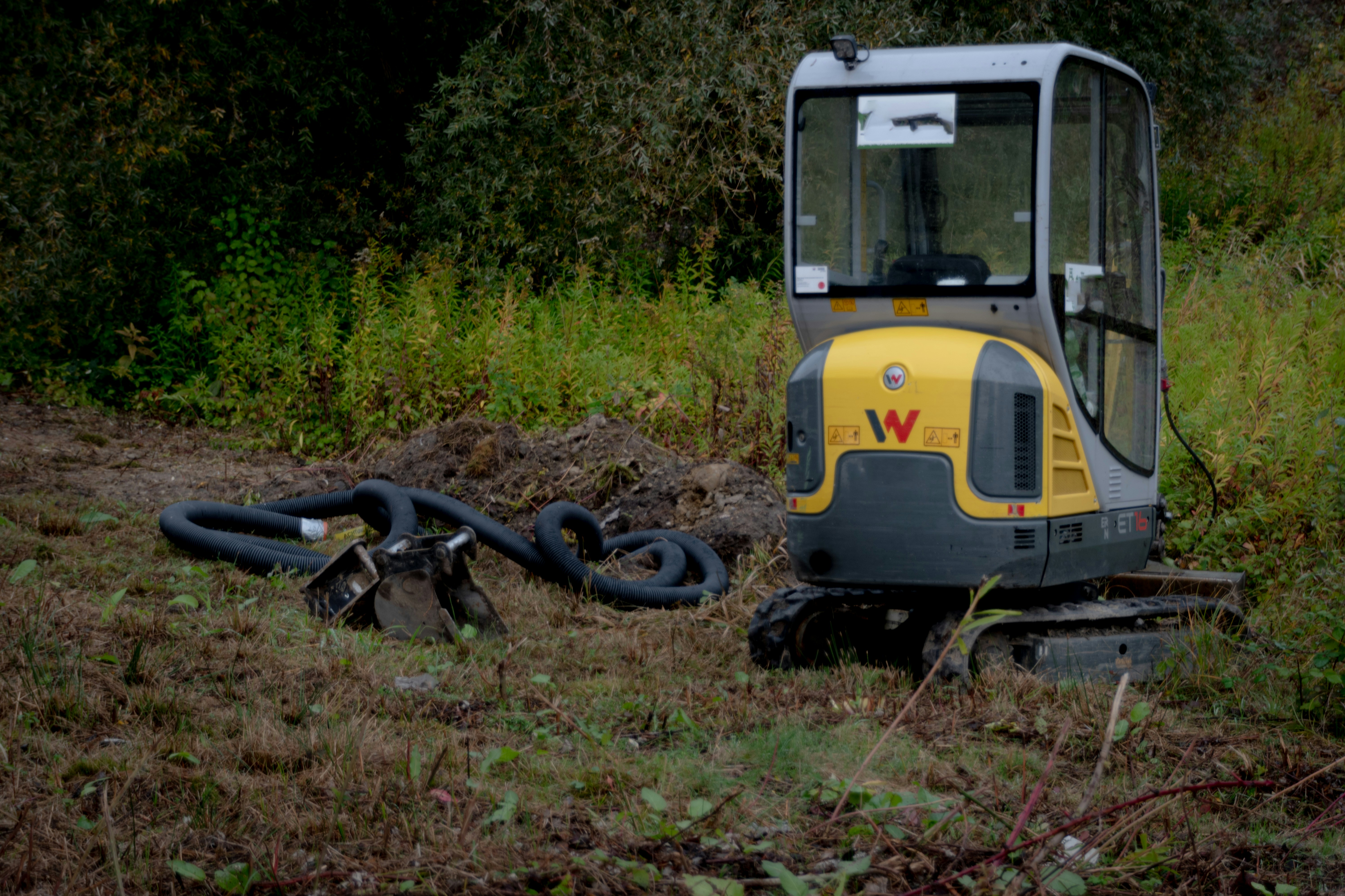 Mini excavator digging a trench