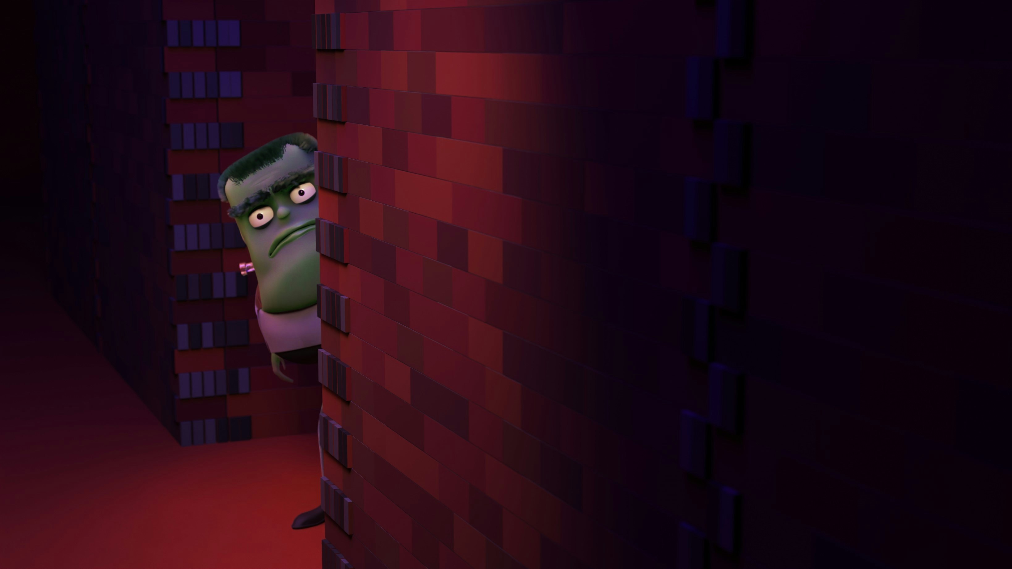 Green monster peeking around a brick wall