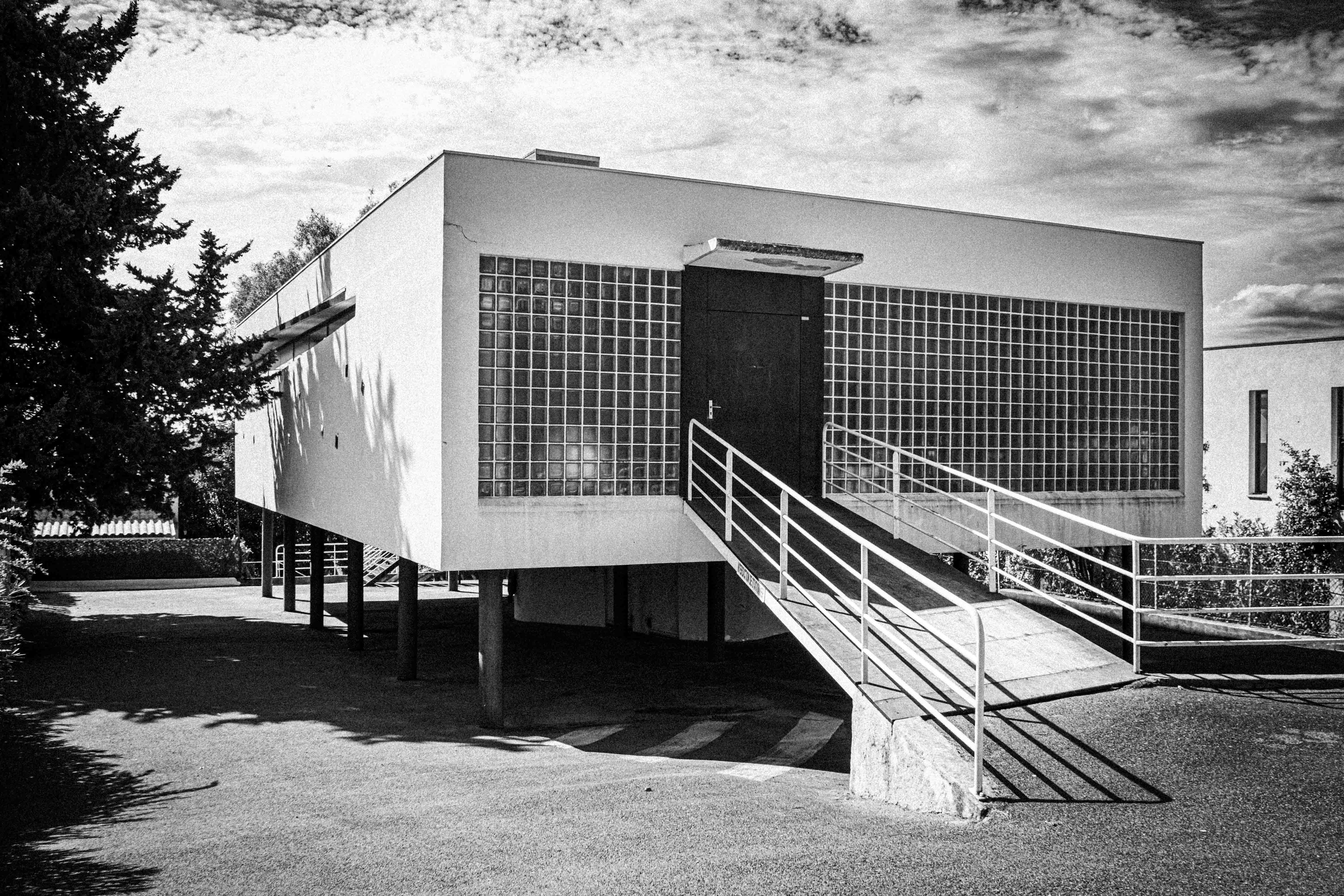 Modern building on stilts with glass block windows
