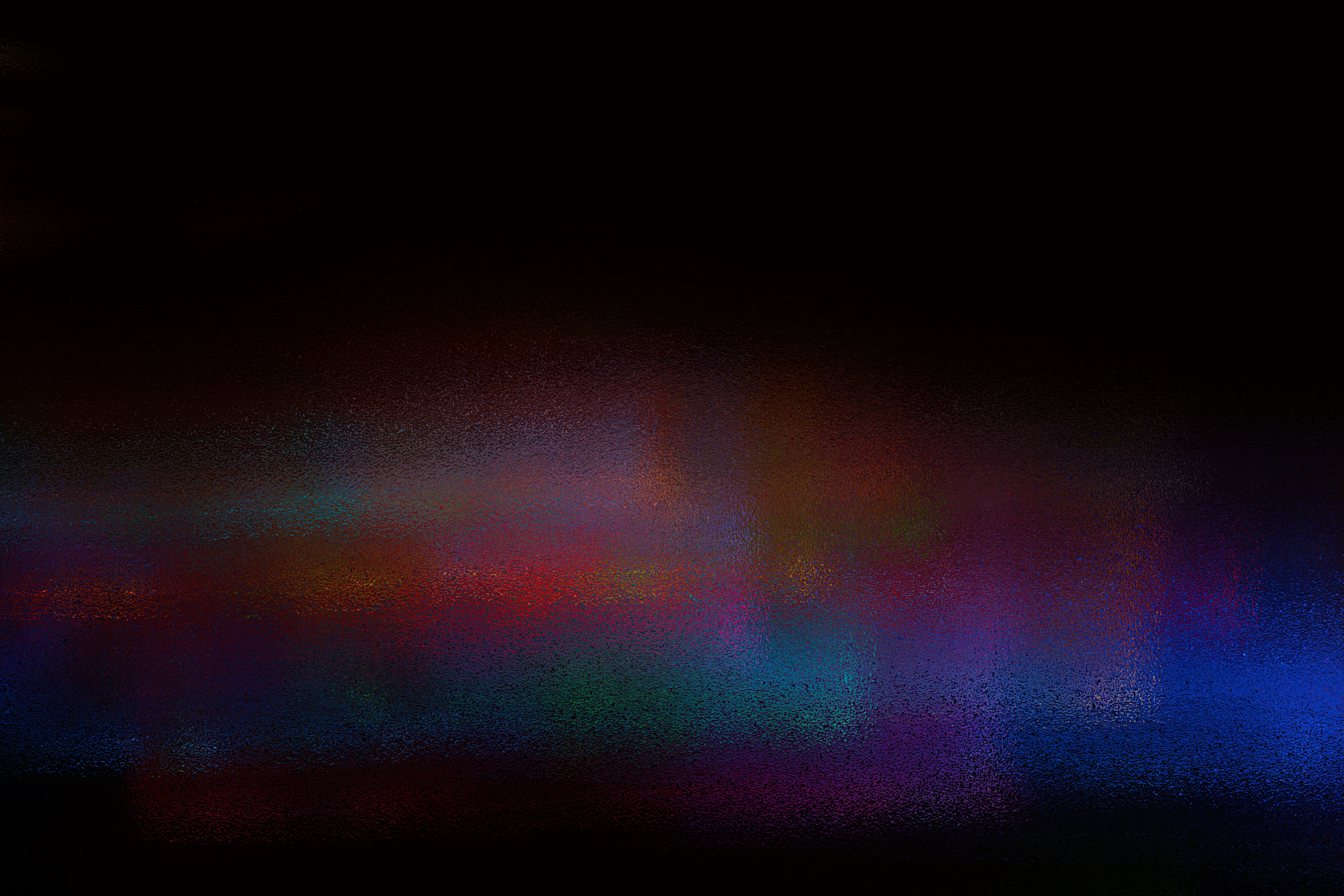 Abstract colorful lights blurred in darkness