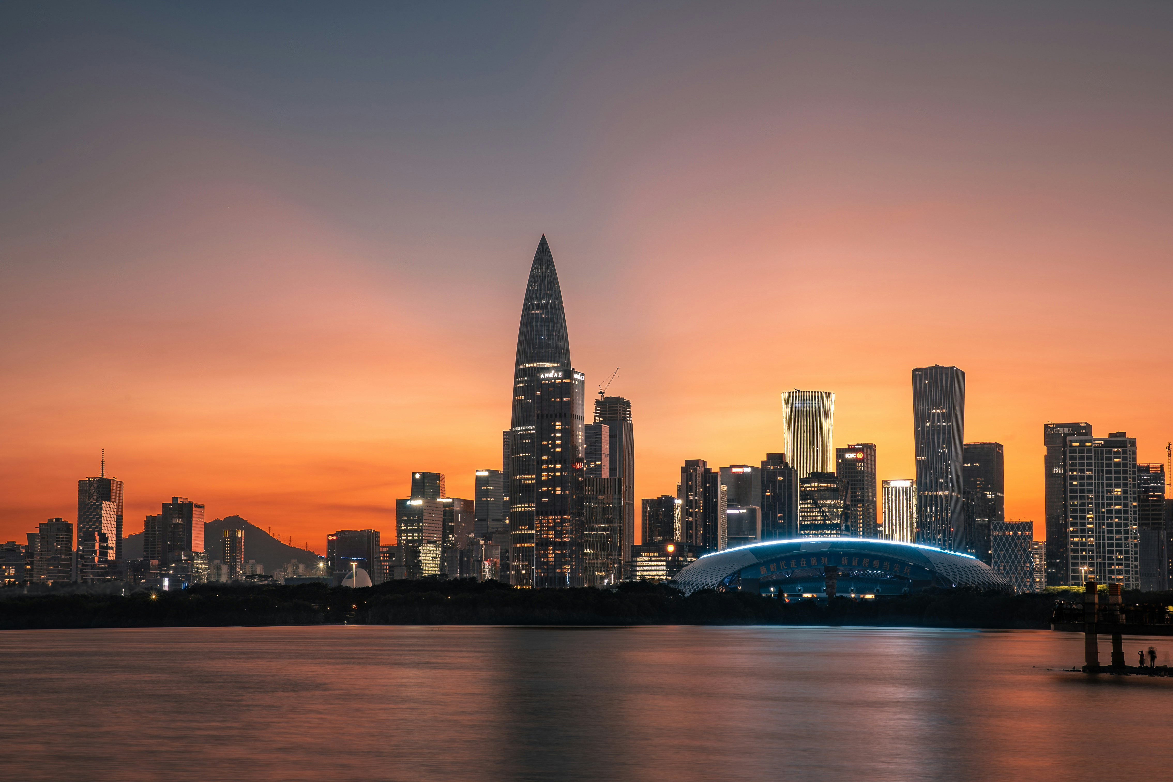 City skyline at sunset over the water