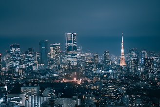 Vibrant cityscape at night with illuminated skyscrapers.