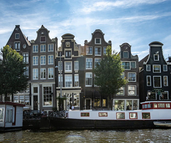 Historic gabled canal houses lining the water in the old quarter