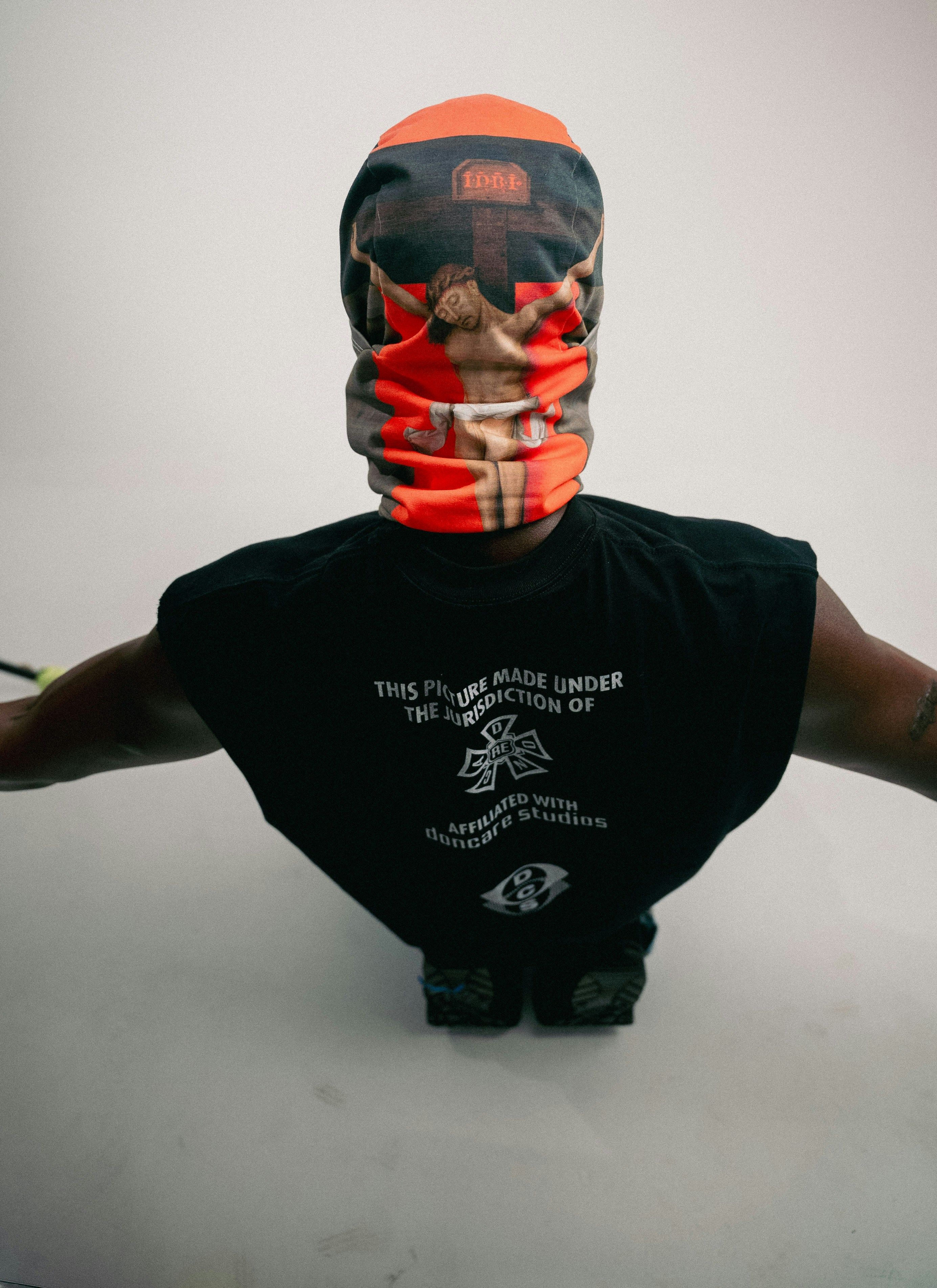 Person wearing a graphic bandana and black t-shirt