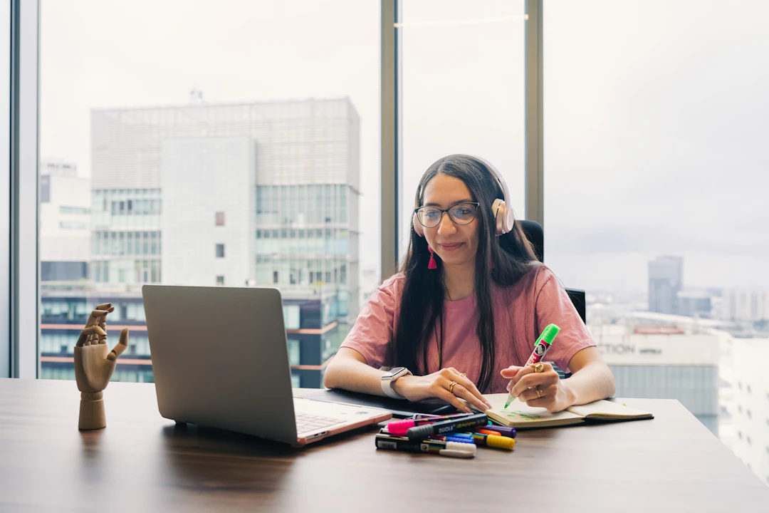 Remote worker wearing headphones while working at a desk