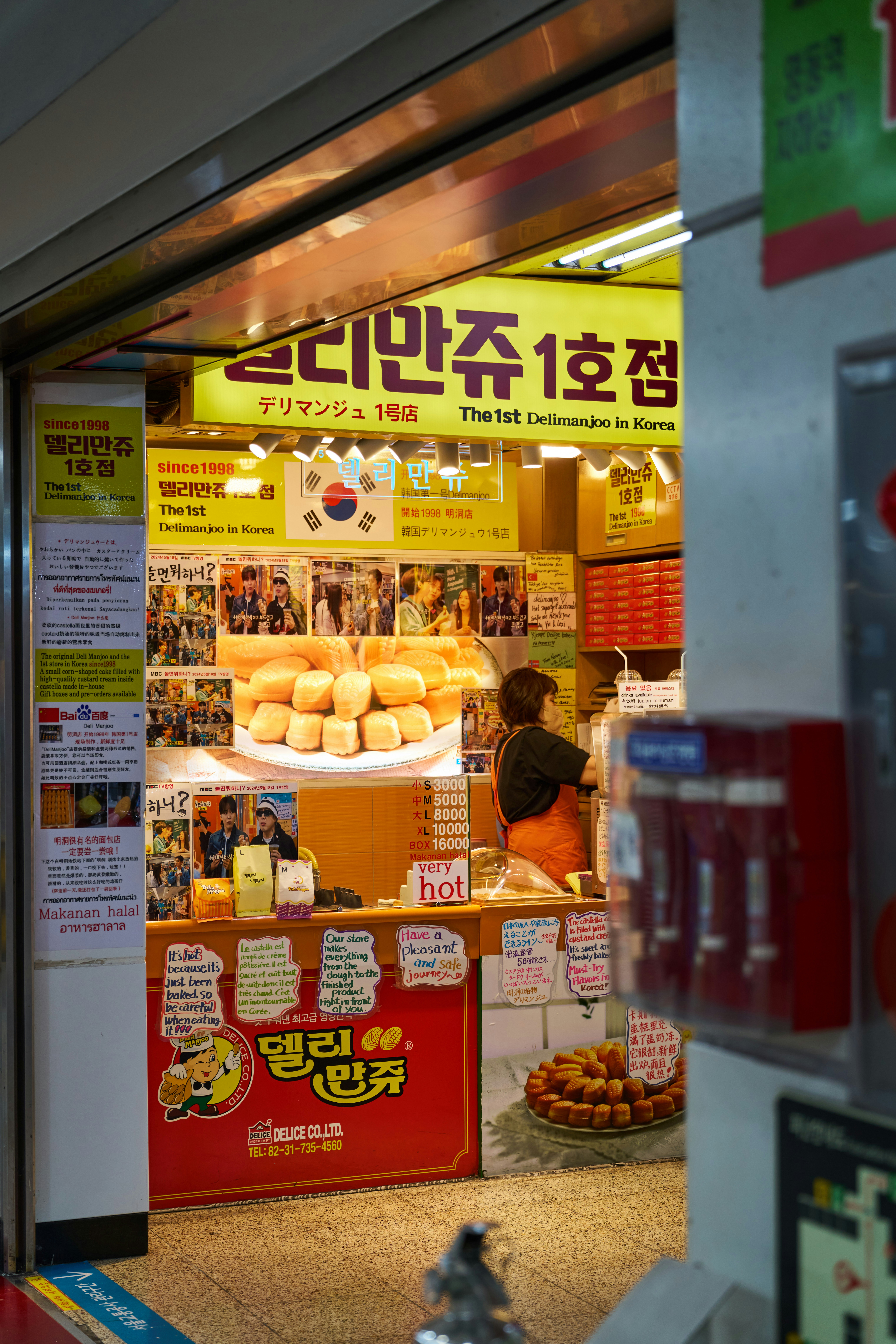 Gwangjang Market food alley with vendors and diners