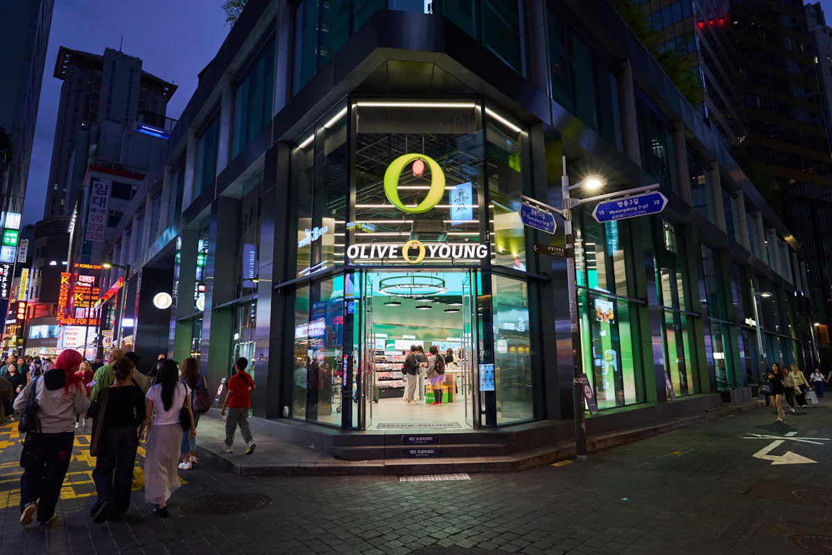 Illuminated corner shopfront on a Korean street at night
