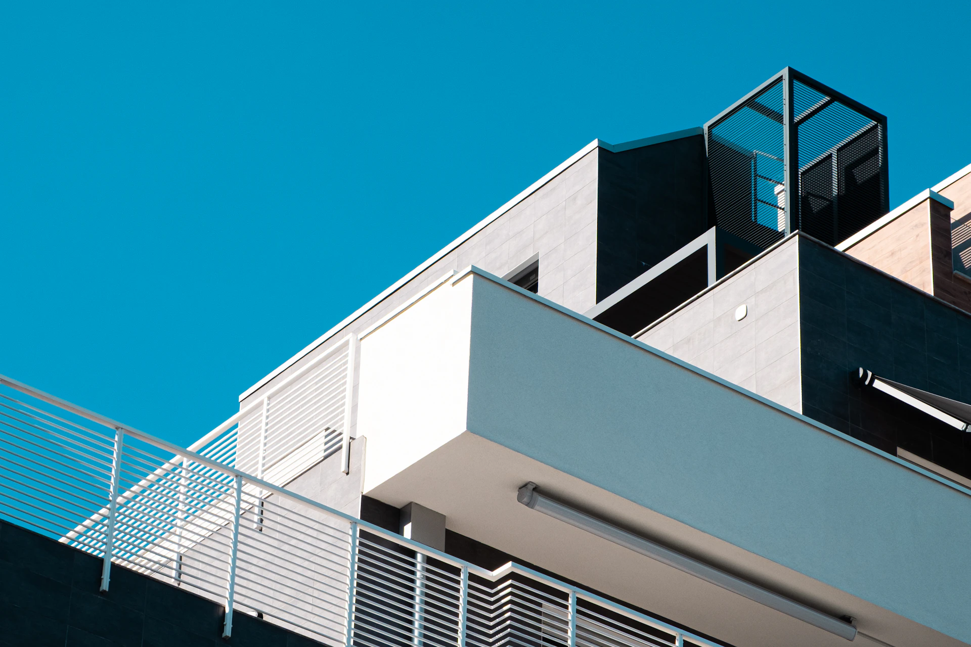 Modern building architecture against a clear blue sky