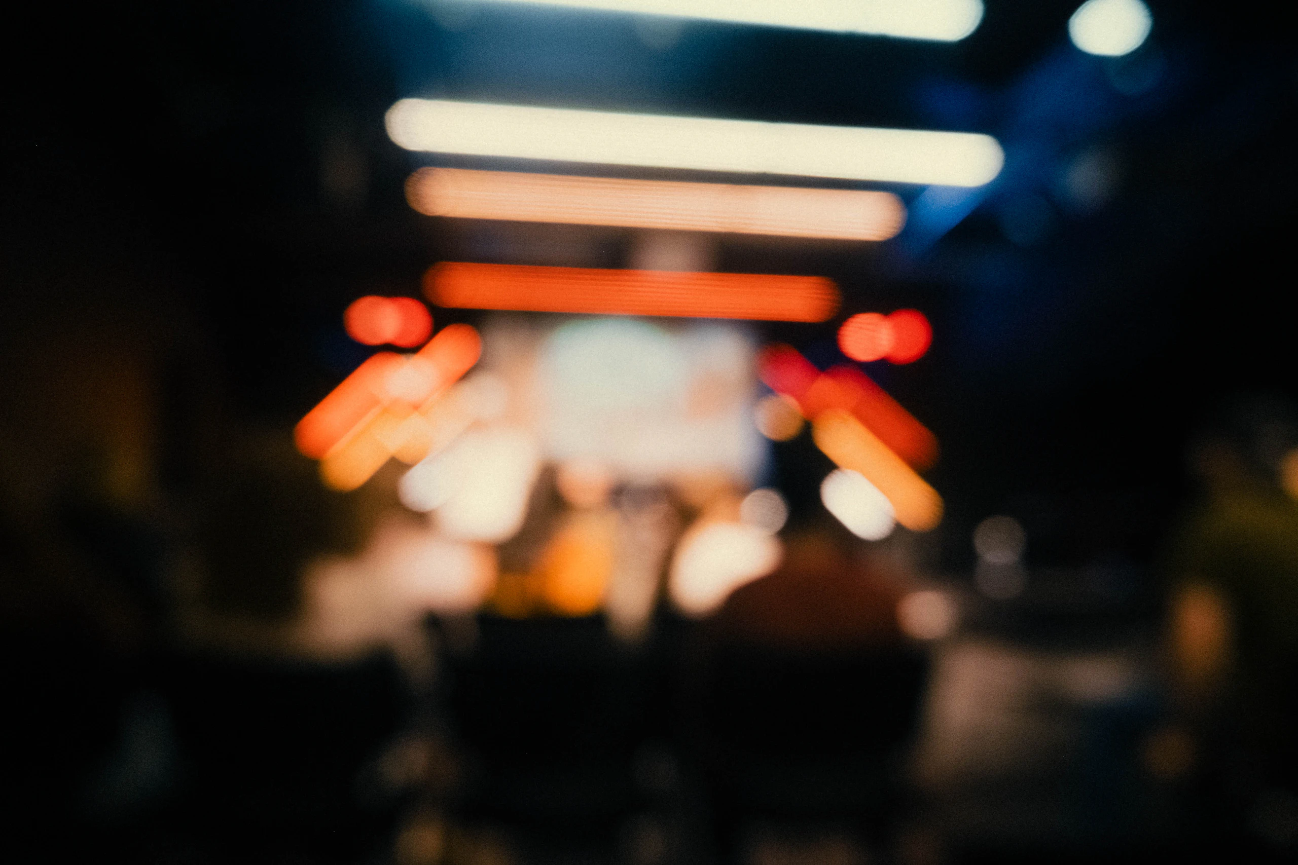 Stage lights and audience silhouettes at an event