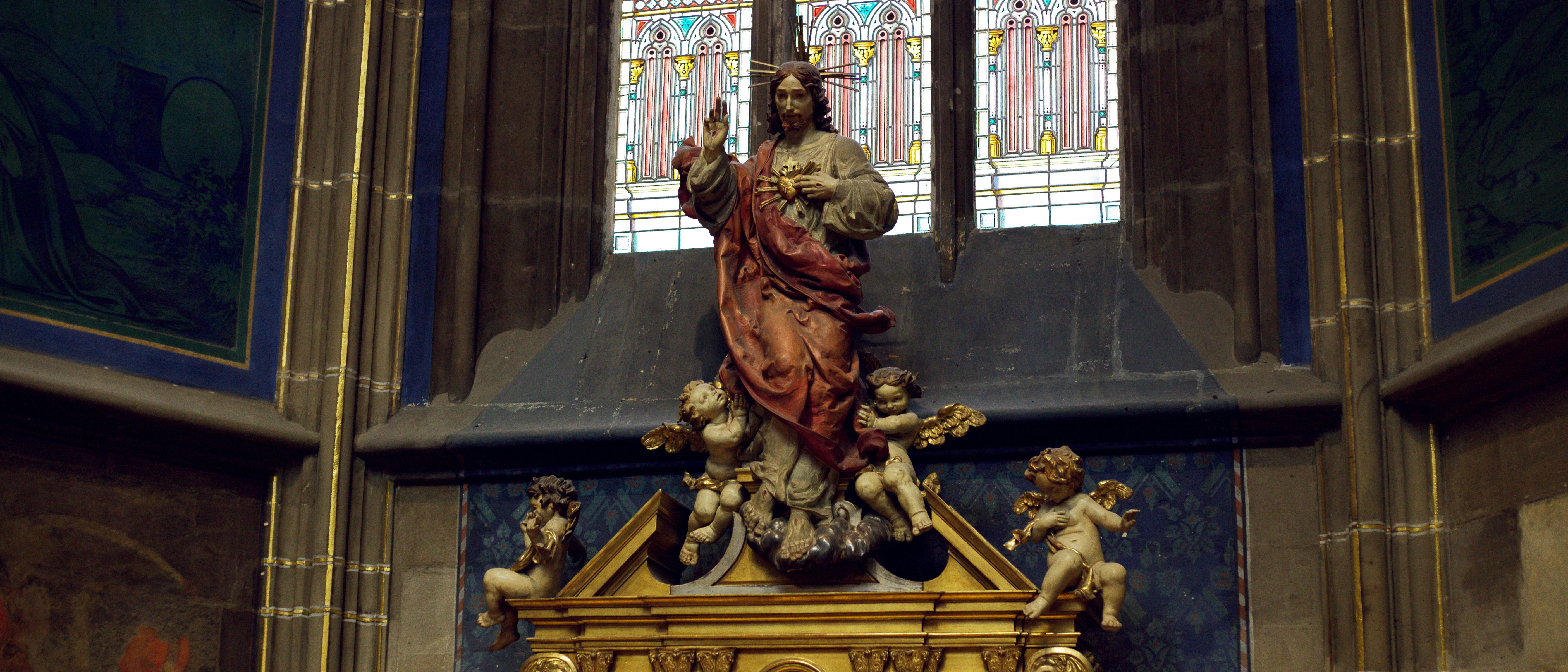Religious sculpture of jesus with cherubs in cathedral