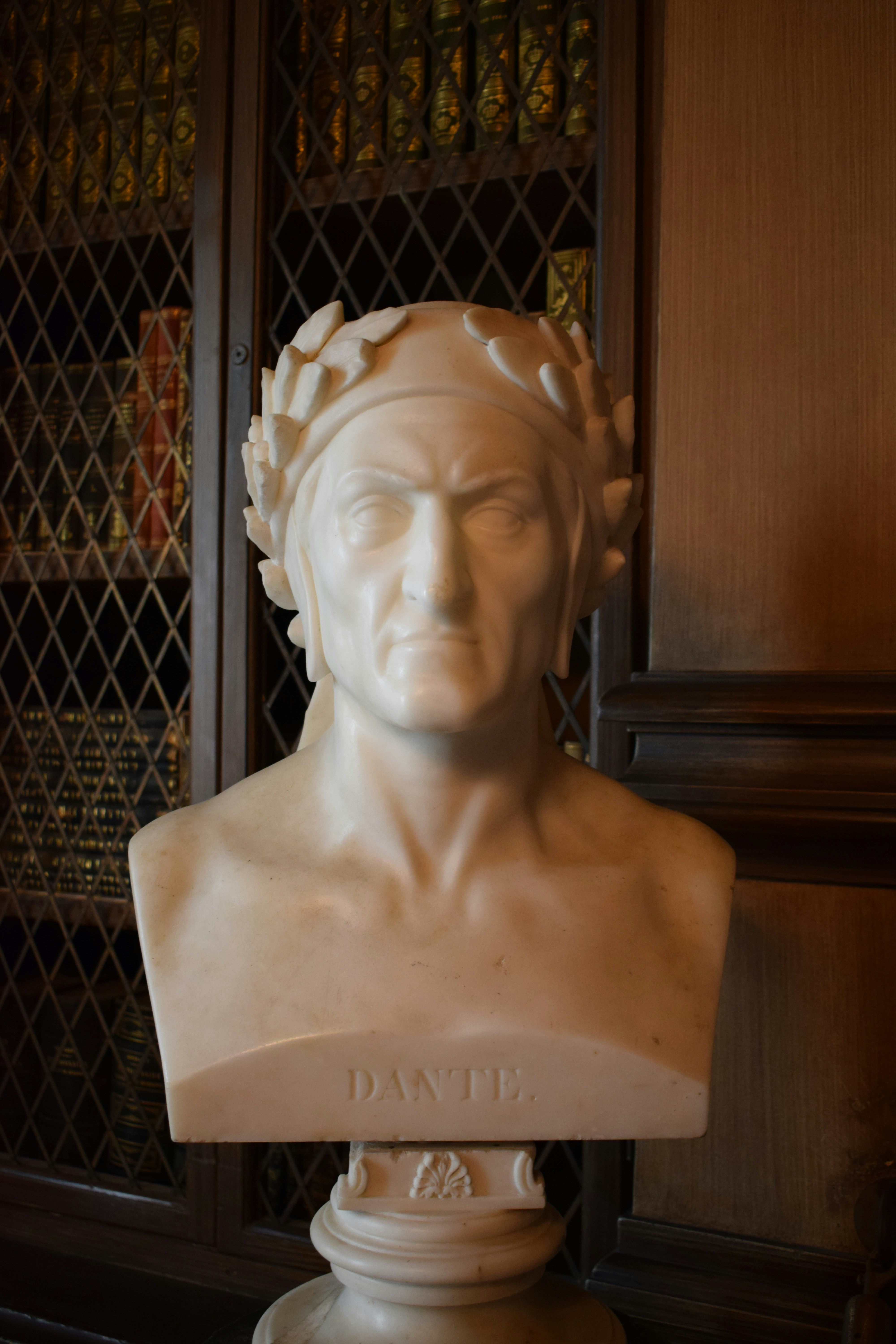Marble bust of dante alighieri with laurel wreath.