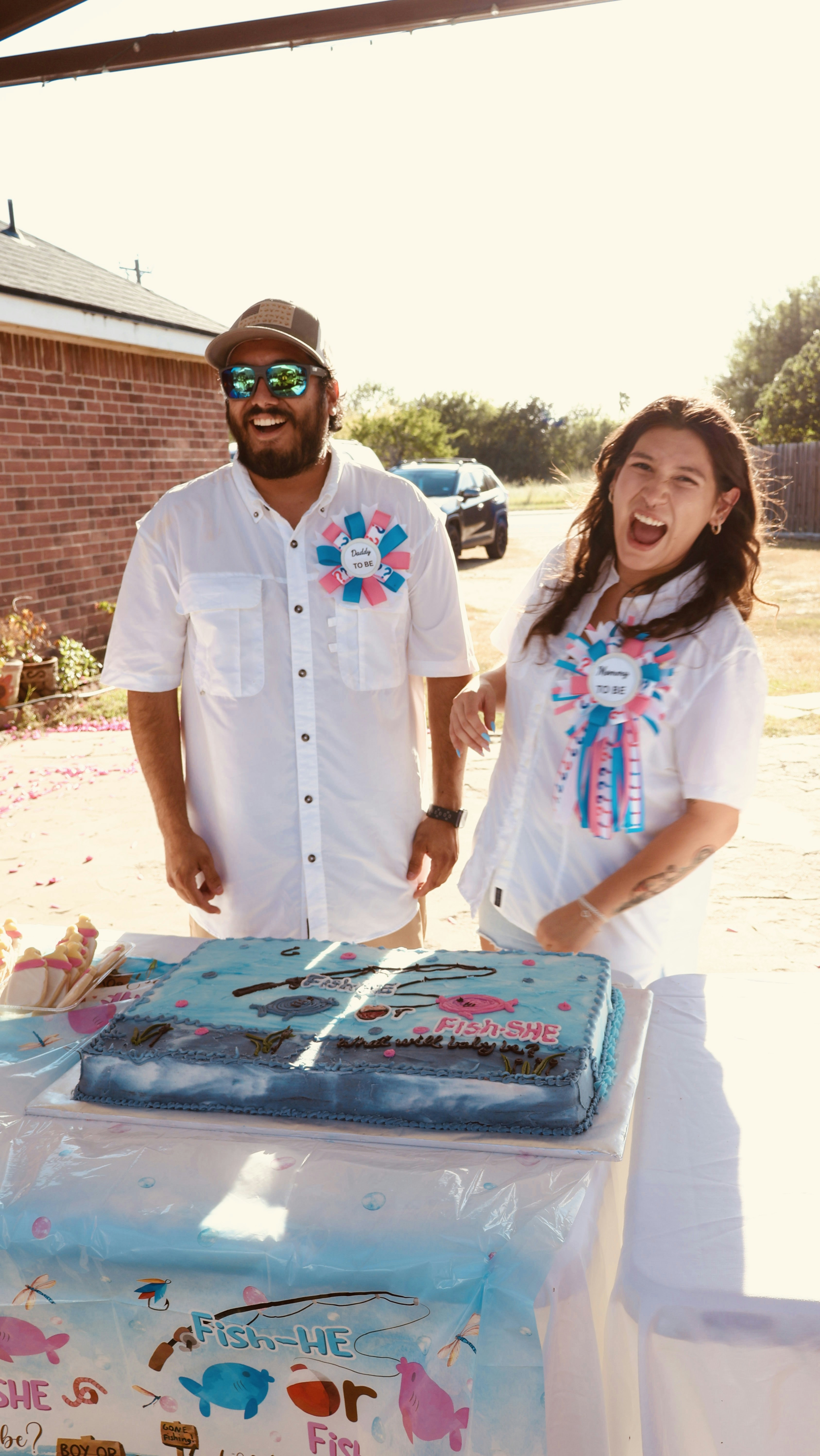 Couple celebrates with a "fish or fin" themed cake.