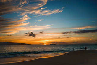 Sunset over the ocean with colorful clouds