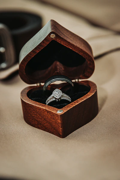 Wedding rings in a heart-shaped wooden box