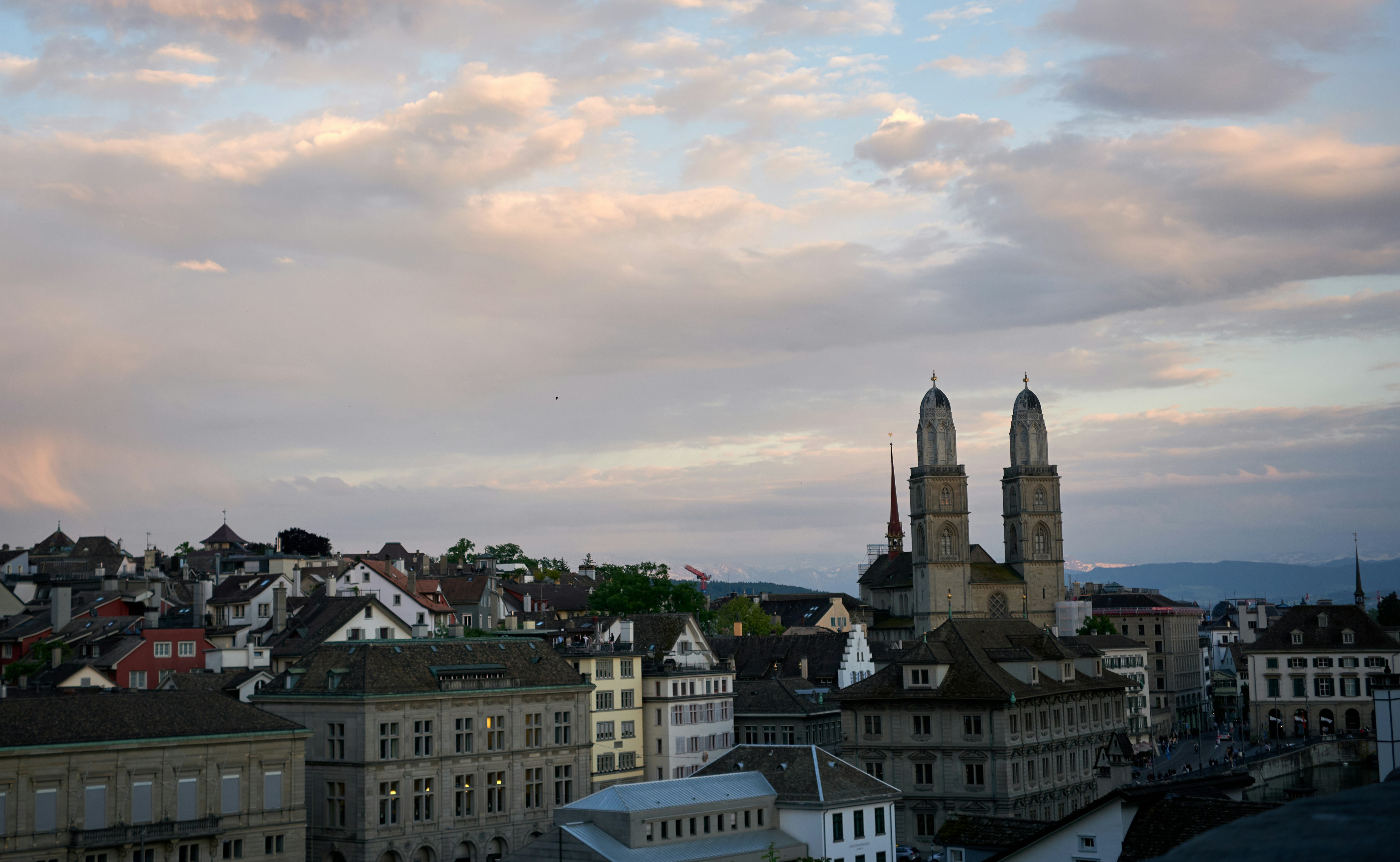 City skyline with church towers under a cloudy sky