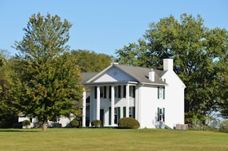 A white colonial-style house with columns.
