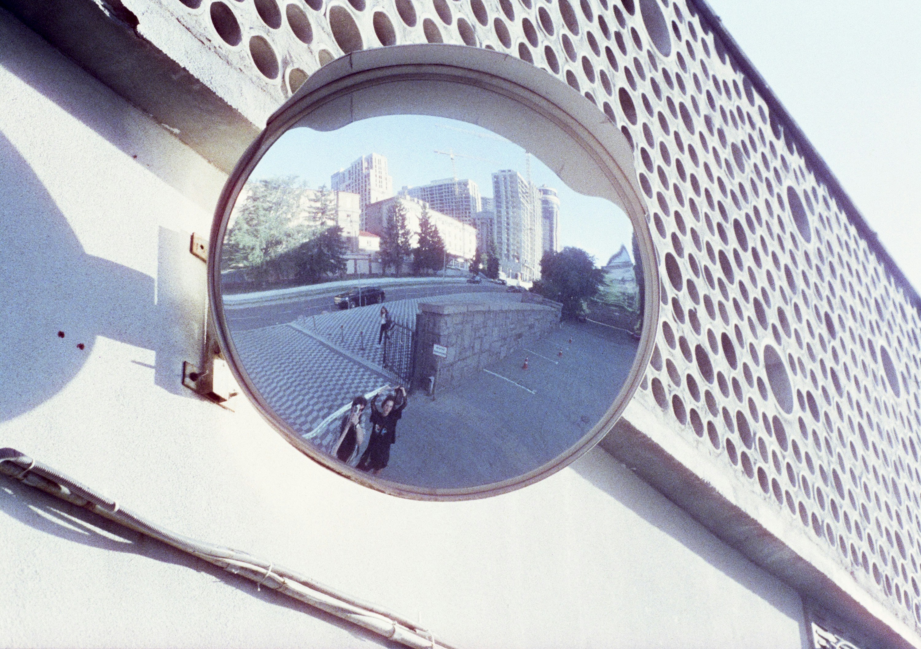 Convex mirror reflecting buildings and road