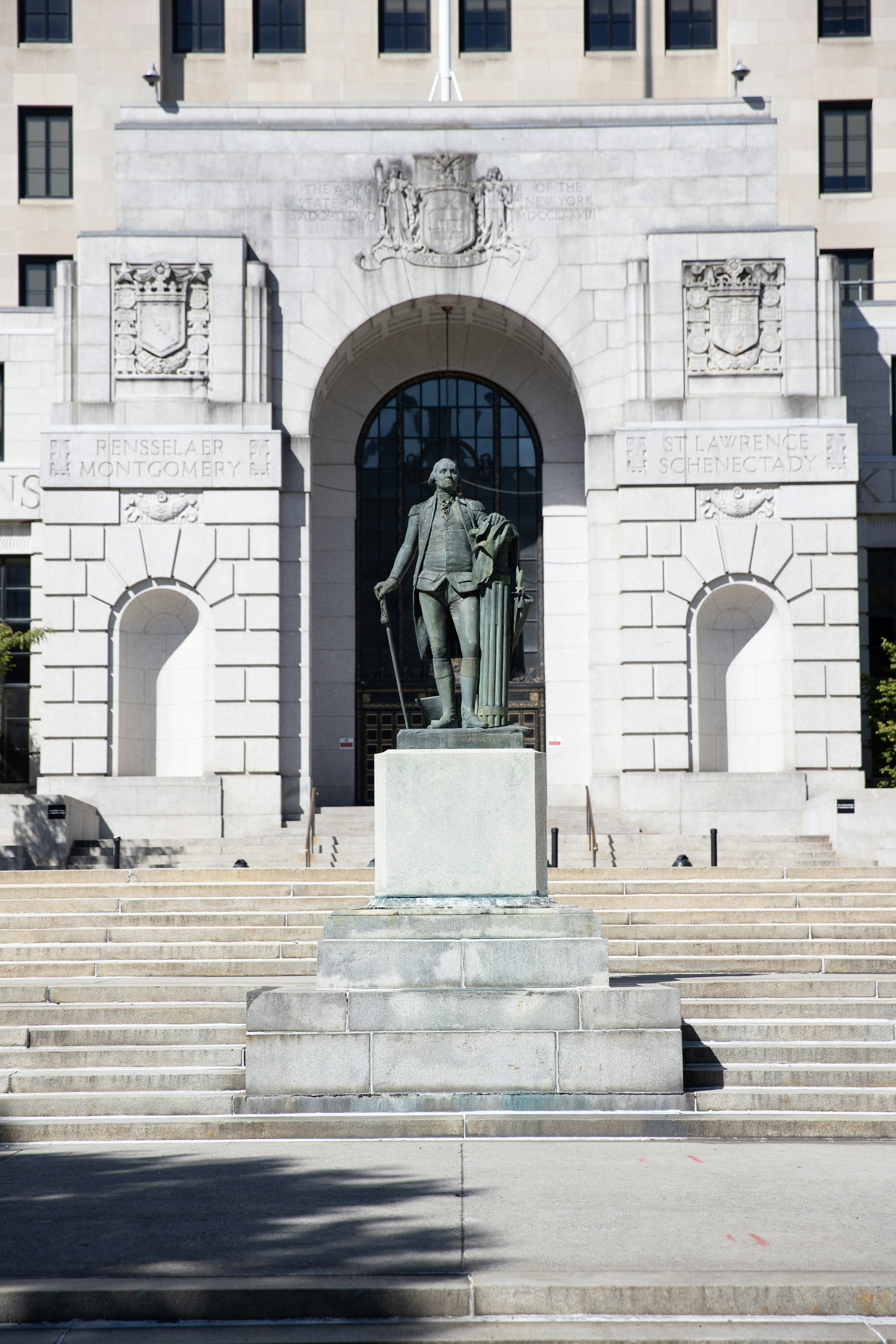 Statue of george washington in front of building