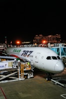 Eva air boeing 787 parked at airport gate at night