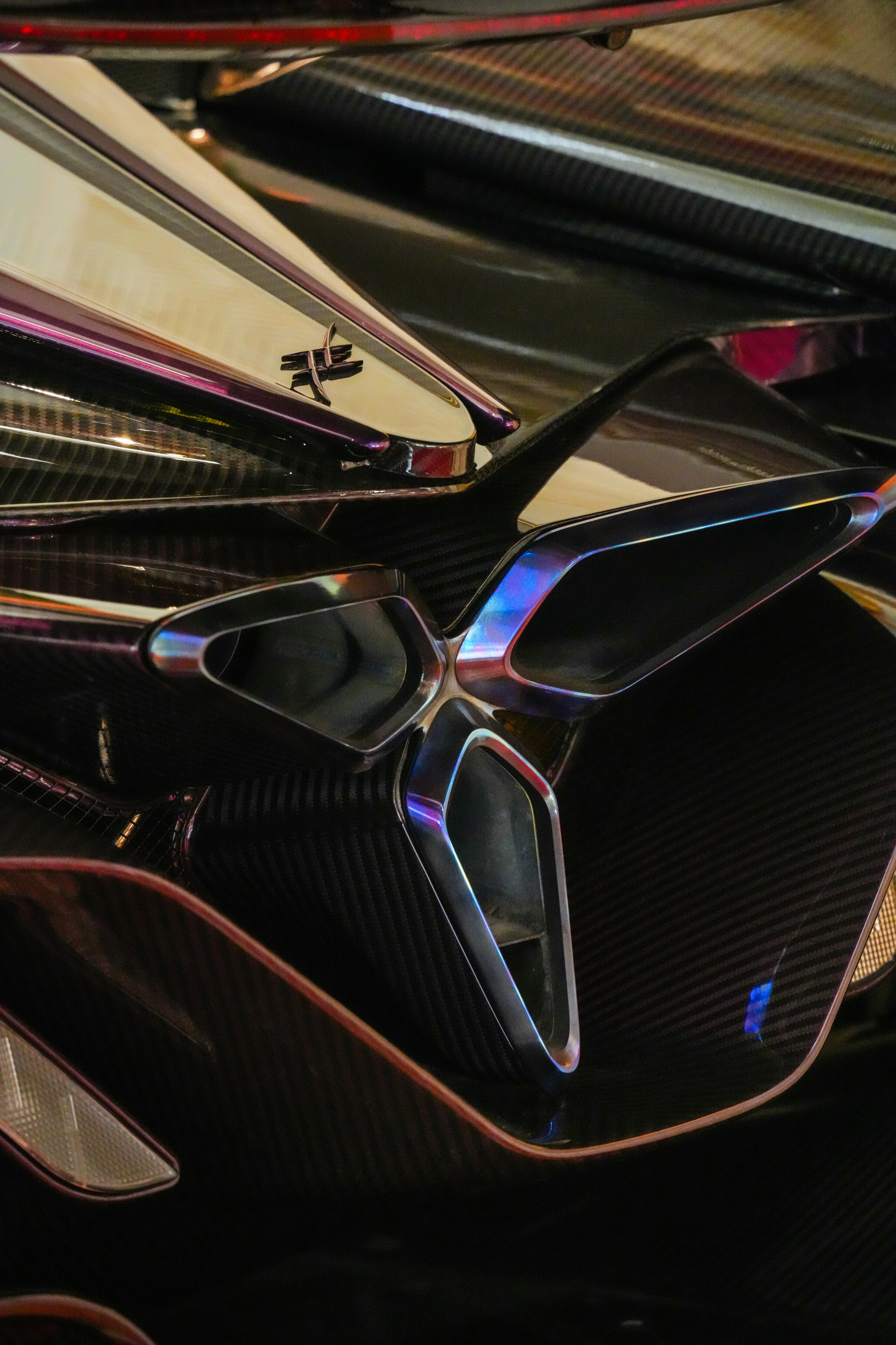 Close-up of a sleek, modern car's aerodynamic details.