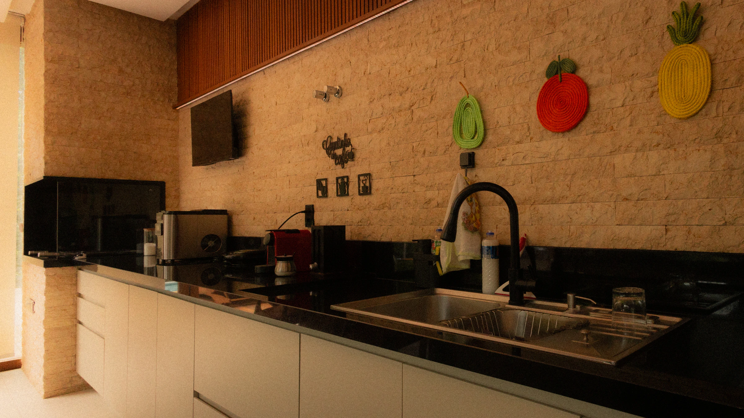 Modern home kitchen counter with coffee machine toaster and countertop appliances