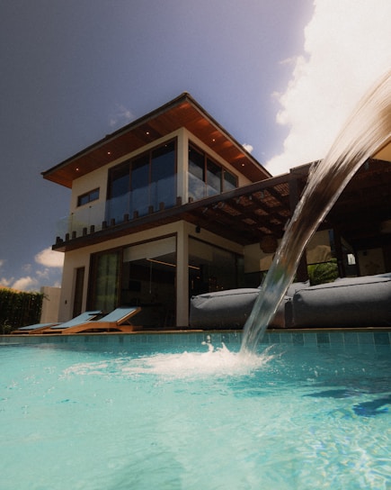 Modern villa with a swimming pool and waterfall