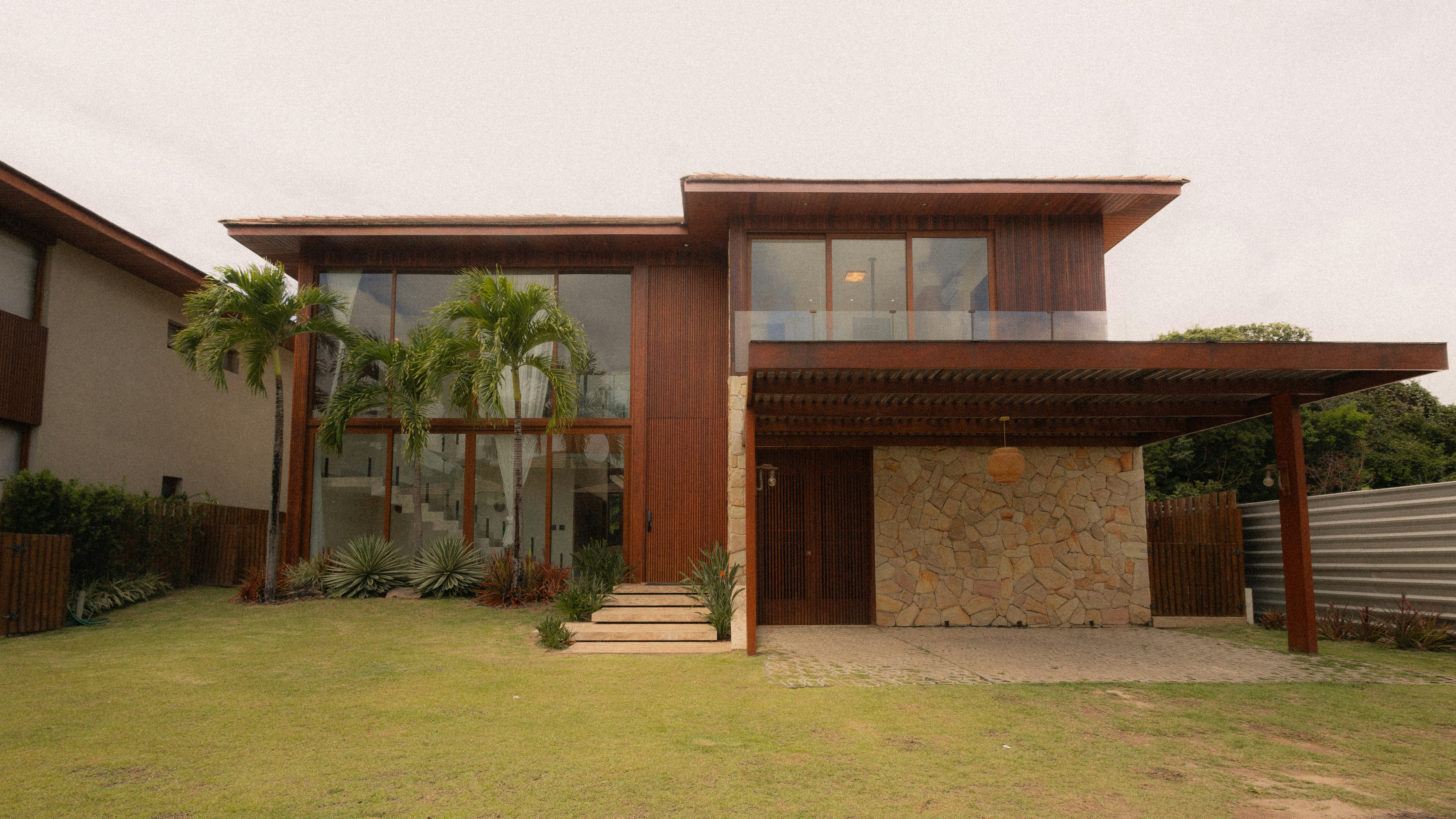 Modern wooden house with carport