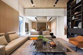 Modern living room with sectional sofa and bookshelf