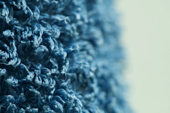 Close-up of textured blue fabric with soft lighting