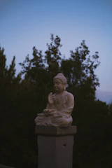 Buddha statue sits peacefully at dusk