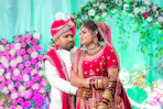 Newlyweds in traditional indian wedding attire
