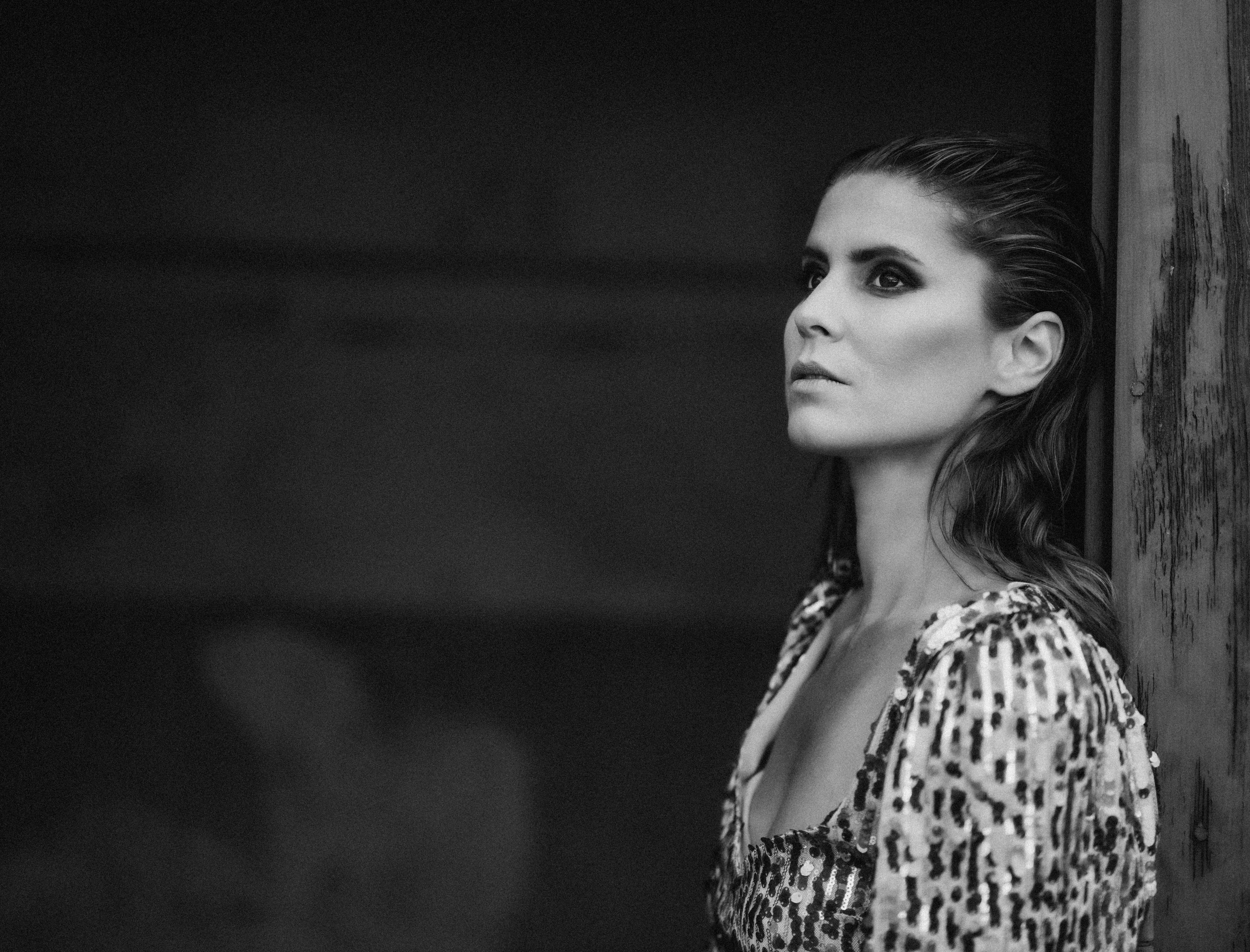 Woman with wet hair looking away thoughtfully