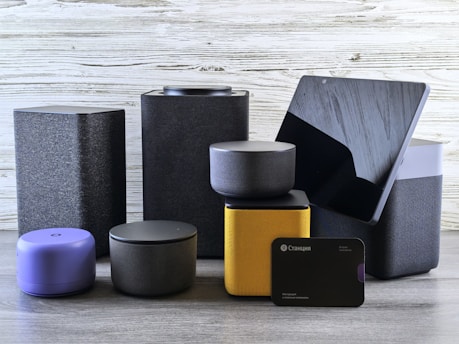 Collection of modern electronic devices and speakers.