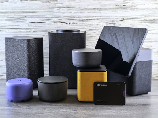 Collection of modern electronic devices and speakers.
