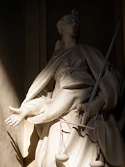 Statue of justice holding scales and sword