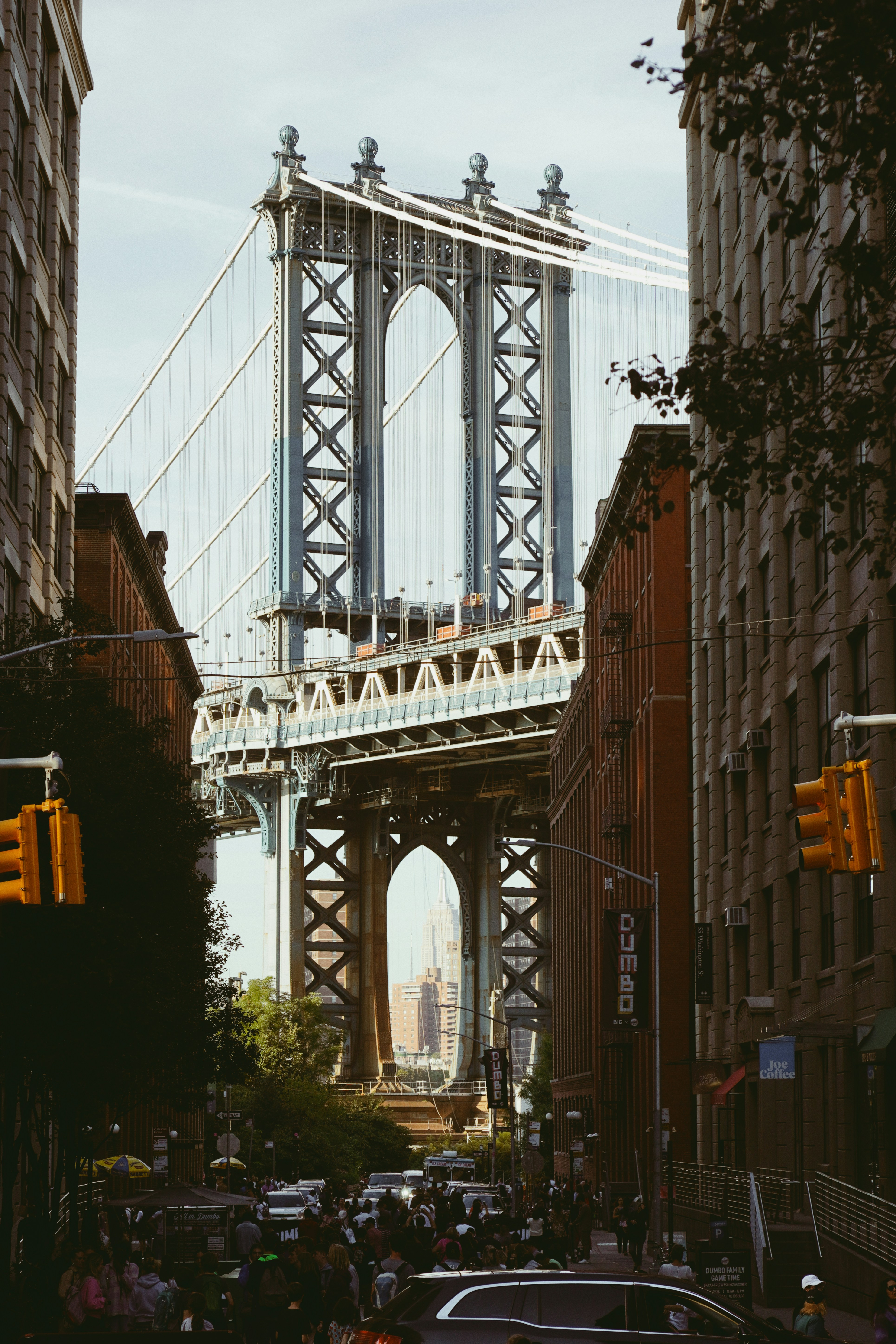 Manhattan bridge viewed between city buildings