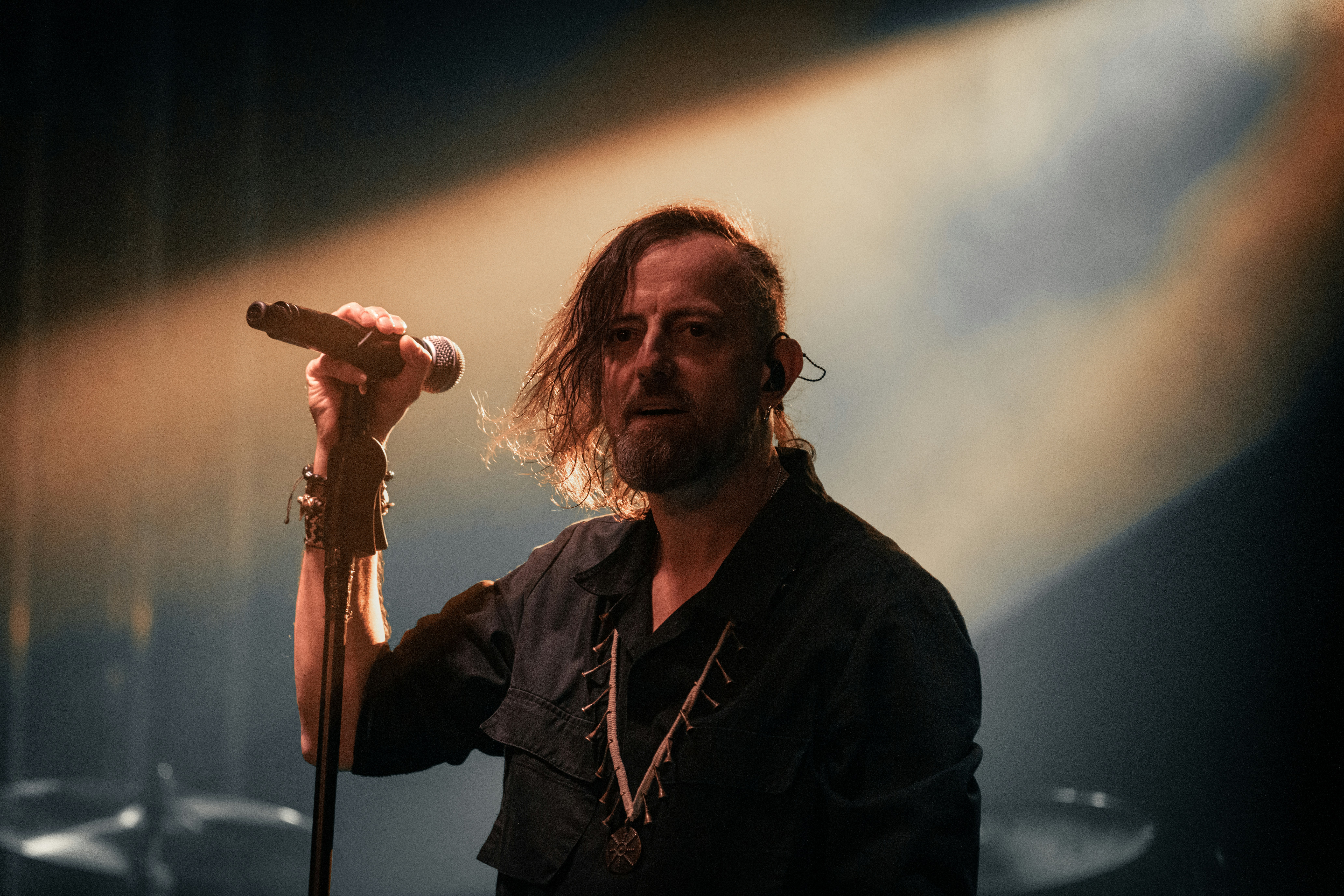 A man holding a microphone on stage