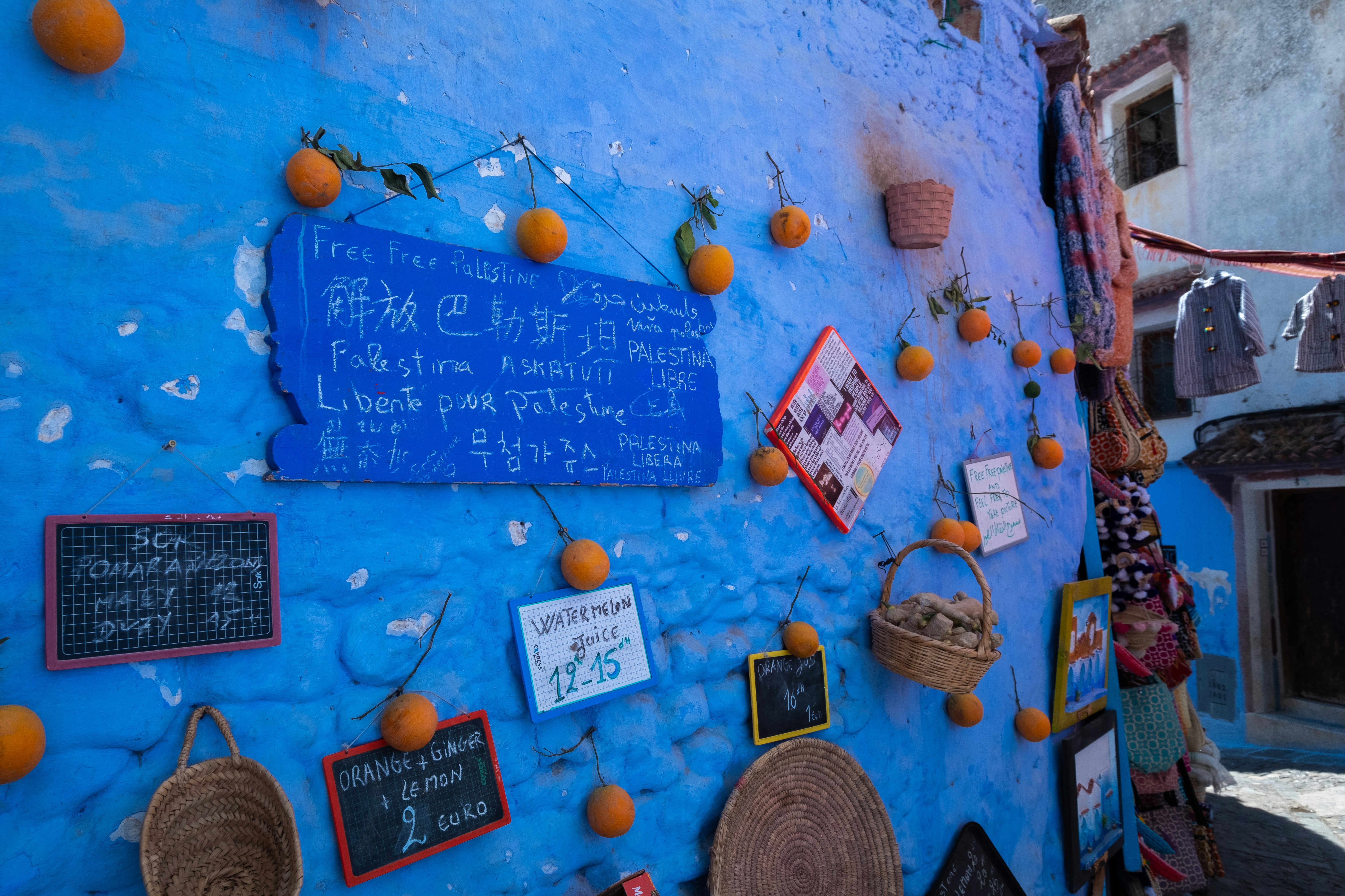 Blue wall with signs and oranges