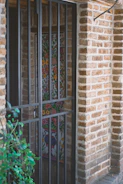 Ornate door behind metal security bars