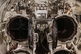 Inside view of submarine torpedo tubes and controls