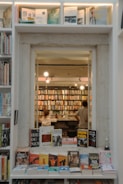 Bookshelves filled with books in a cozy bookstore.