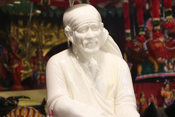White marble statue of a religious figure.