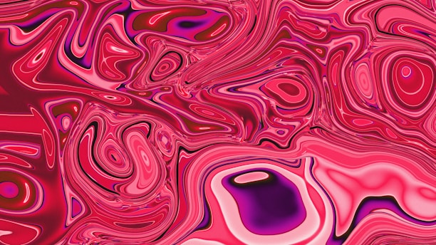 Swirling abstract pattern of pink and purple hues